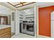Convenient laundry closet featuring modern appliances and organized shelving, maximizing space and functionality at 721 Bourbon St # F2, Pahrump, NV 89048