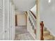 Hallway providing access to the stairway and view into adjacent living room area at 721 Bourbon St # F2, Pahrump, NV 89048