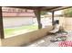 Covered patio offers shaded seating with relaxing lounge chairs and a view of the community lawn at 721 Bourbon St # F2, Pahrump, NV 89048