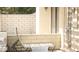 Outdoor patio area with seating, framed by a brick wall and garden at 721 Bourbon St # F2, Pahrump, NV 89048