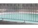 Neighborhood pool behind decorative metal fence at 721 Bourbon St # F2, Pahrump, NV 89048