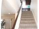 Carpeted staircase leads to an upstairs landing area with a built-in desk and ample natural light at 721 Bourbon St # F2, Pahrump, NV 89048