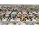 An aerial view of a neighborhood with similar two-story homes and desert landscaping at 7819 Rachelis St, North Las Vegas, NV 89084
