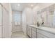 Bright bathroom with double sinks, granite countertop, and shower, offering elegance at 7819 Rachelis St, North Las Vegas, NV 89084