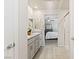 A bright bathroom leads to the main bedroom; notice the double sinks and granite counters at 7819 Rachelis St, North Las Vegas, NV 89084