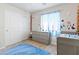 Lovely bedroom with ample closet space, dresser, and crib, designed for style and comfort at 7819 Rachelis St, North Las Vegas, NV 89084