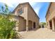 Beautiful two-story home with archway entrance and desert landscaping at 7819 Rachelis St, North Las Vegas, NV 89084
