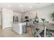 Modern kitchen with stainless steel appliances, granite countertops, and an island at 7819 Rachelis St, North Las Vegas, NV 89084