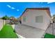Spacious backyard showing covered patio, block wall, and artificial lawn at 8250 Lincoln Valley St, Las Vegas, NV 89123