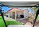 Relax and unwind on the backyard swing, overlooking the covered patio, grill, and desert landscape at 8250 Lincoln Valley St, Las Vegas, NV 89123