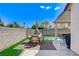 Beautiful backyard with brick and concrete pavers, covered patio, and barbecue at 8250 Lincoln Valley St, Las Vegas, NV 89123