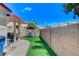 Picture of the home's backyard showcasing a covered patio, dining table, and yard at 8250 Lincoln Valley St, Las Vegas, NV 89123