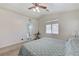 The primary bedroom offers carpet, a ceiling fan, and an ensuite bath at 8250 Lincoln Valley St, Las Vegas, NV 89123