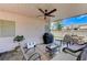 Covered patio with a ceiling fan is ideal for outdoor entertaining and shaded relaxation at 8250 Lincoln Valley St, Las Vegas, NV 89123