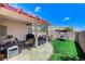 Backyard covered patio with ceiling fan is the ideal spot for outdoor dining and relaxation at 8250 Lincoln Valley St, Las Vegas, NV 89123