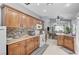 Kitchen featuring dark wood cabinetry, granite countertops, and stainless steel appliances at 8250 Lincoln Valley St, Las Vegas, NV 89123