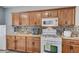 Bright kitchen featuring granite countertops and stainless steel appliances at 8250 Lincoln Valley St, Las Vegas, NV 89123