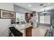 Galley kitchen with granite countertops, modern appliances, and bar seating at 8250 Lincoln Valley St, Las Vegas, NV 89123