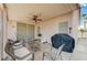 Covered patio space with ample seating, stone flooring, and privacy wall at 8250 Lincoln Valley St, Las Vegas, NV 89123