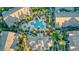 Aerial view of the community featuring a pool, palm trees, and multiple buildings at 8250 N Grand Canyon Dr # 2154, Las Vegas, NV 89166