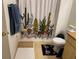 Bathroom featuring a vanity, toilet with a kitty rug, and a shower with cactus curtain at 8250 N Grand Canyon Dr # 2154, Las Vegas, NV 89166