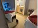 Bedroom showcasing a cat tree reflected in a mirror, next to a well-lit vanity area at 8250 N Grand Canyon Dr # 2154, Las Vegas, NV 89166