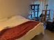 Bedroom with a comfy bed, cat tree, and an art easel, creating a unique living space at 8250 N Grand Canyon Dr # 2154, Las Vegas, NV 89166