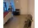 Bedroom with a comfortable bed, storage cart, and a cat tree by the window at 8250 N Grand Canyon Dr # 2154, Las Vegas, NV 89166
