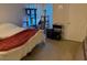 Bright bedroom featuring a cozy bed, a cat tree, and an art easel near the window at 8250 N Grand Canyon Dr # 2154, Las Vegas, NV 89166