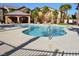 Community pool with clear blue water, ample seating, and an open-air pavilion at 8250 N Grand Canyon Dr # 2154, Las Vegas, NV 89166