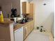 An open kitchen with dishwasher and sink plus cabinet storage is perfect for gatherings at 8250 N Grand Canyon Dr # 2154, Las Vegas, NV 89166