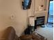 Cozy living room features a fireplace, television, and access to outdoor balcony at 8250 N Grand Canyon Dr # 2154, Las Vegas, NV 89166