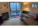 A living room featuring an outdoor balcony, fireplace and comfortable seating at 8250 N Grand Canyon Dr # 2154, Las Vegas, NV 89166