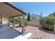 View of covered patio and easy to maintain landscaping in the backyard at 8847 W Katie Ave, Las Vegas, NV 89147