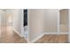 Hallway view towards a modern bathroom with a walk-in shower and double sinks at 8847 W Katie Ave, Las Vegas, NV 89147