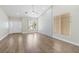 Bright living room boasting hardwood floors, large windows, and a welcoming entryway at 8847 W Katie Ave, Las Vegas, NV 89147