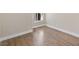 A corner of a room with wooden floors and a window at 8847 W Katie Ave, Las Vegas, NV 89147