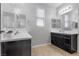 Bathroom features double vanity with quartz countertops and modern fixtures plus ample storage at 8953 Hitch Creek St, Las Vegas, NV 89131