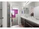 Bathroom with double vanity and quartz countertops with a view to a connected bedroom at 8953 Hitch Creek St, Las Vegas, NV 89131