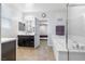 Bright bathroom features a soaking tub, dark cabinets and double sinks with modern fixtures at 8953 Hitch Creek St, Las Vegas, NV 89131