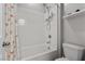 Bathroom features a combined shower and tub plus white tiling and modern fixtures at 8953 Hitch Creek St, Las Vegas, NV 89131
