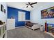 Cozy bedroom with custom paint features ample natural light, carpet, and modern design at 8953 Hitch Creek St, Las Vegas, NV 89131
