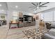 Cozy living room with large media center and layered rugs creates a relaxing atmosphere at 8953 Hitch Creek St, Las Vegas, NV 89131