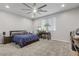 Spacious main bedroom has neutral walls, large windows, modern ceiling fan, and is well appointed at 8953 Hitch Creek St, Las Vegas, NV 89131