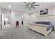 Spacious main bedroom features an elegant bed frame, ceiling fan, and ensuite bathroom at 8953 Hitch Creek St, Las Vegas, NV 89131