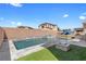 Backyard pool with spa, fire pit, and artificial turf, perfect for outdoor entertaining at 8953 Hitch Creek St, Las Vegas, NV 89131