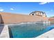 Inviting backyard pool and spa with soothing water feature, set against a serene backdrop at 8953 Hitch Creek St, Las Vegas, NV 89131