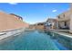 Beautiful backyard pool and spa with lush artificial turf and inviting outdoor ambiance at 8953 Hitch Creek St, Las Vegas, NV 89131