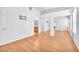 Bedroom featuring hardwood floors, white walls, closet with mirrored doors and bathroom access at 8985 S Durango Dr # 1110, Las Vegas, NV 89113