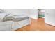 Bedroom with hardwood floors and view of closet with white shelves at 8985 S Durango Dr # 1110, Las Vegas, NV 89113